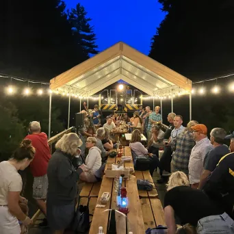 a group of people standing in front of a crowd