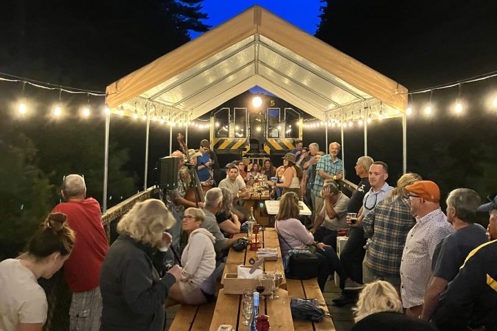 a group of people standing in front of a crowd