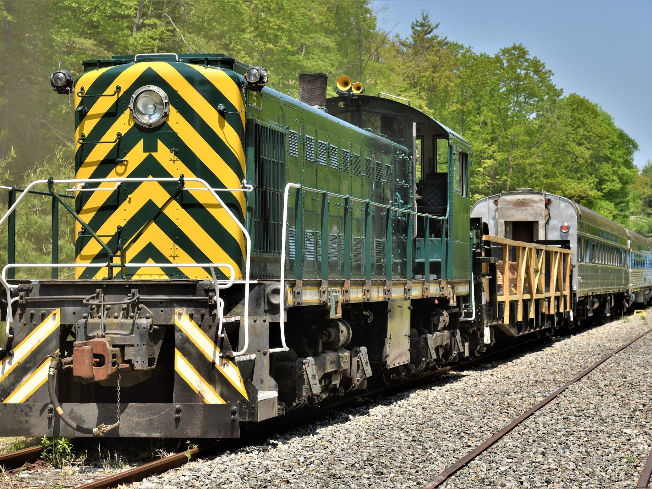 a train engine carrying carts down a track