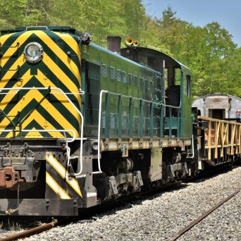 a train engine carrying carts down a track