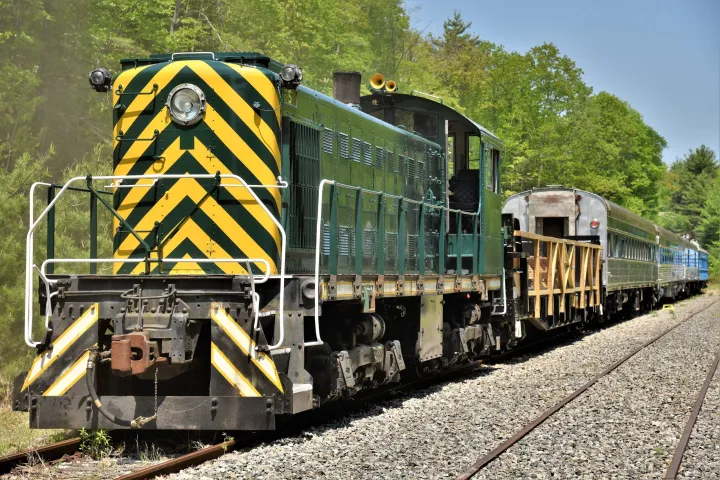 a train engine carrying carts down a track
