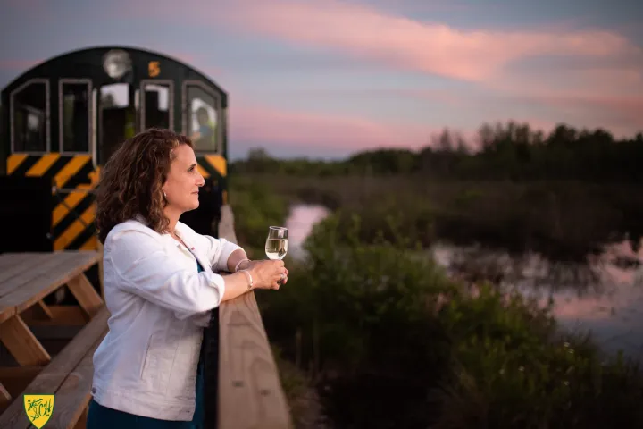 a woman that is standing in the grass