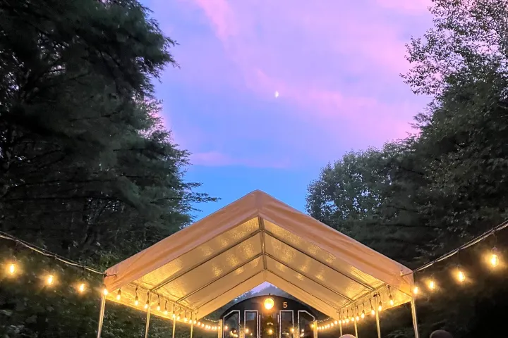 a group of people standing in front of a crowd posing for the camera