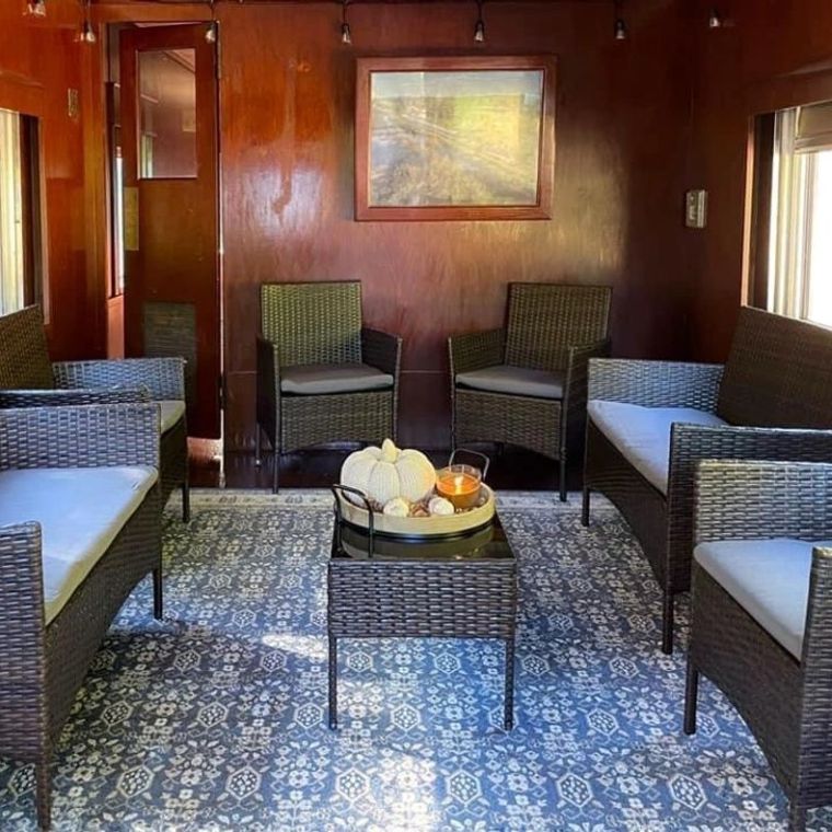 a dining room table in front of a window