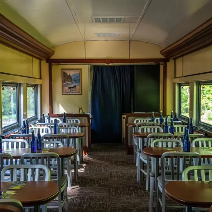 a room filled with furniture and a large window