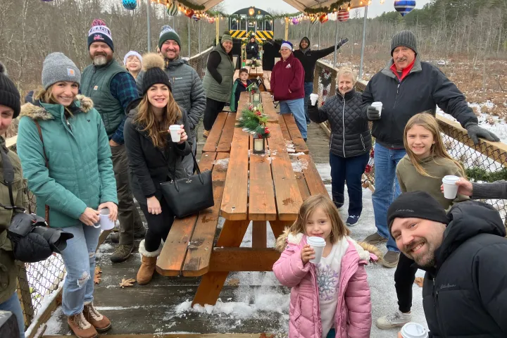 a group of people standing in front of a crowd