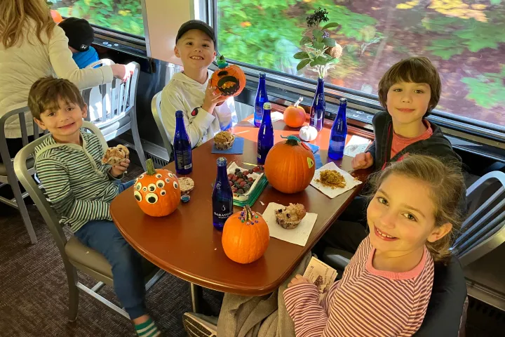a little boy sitting on a table